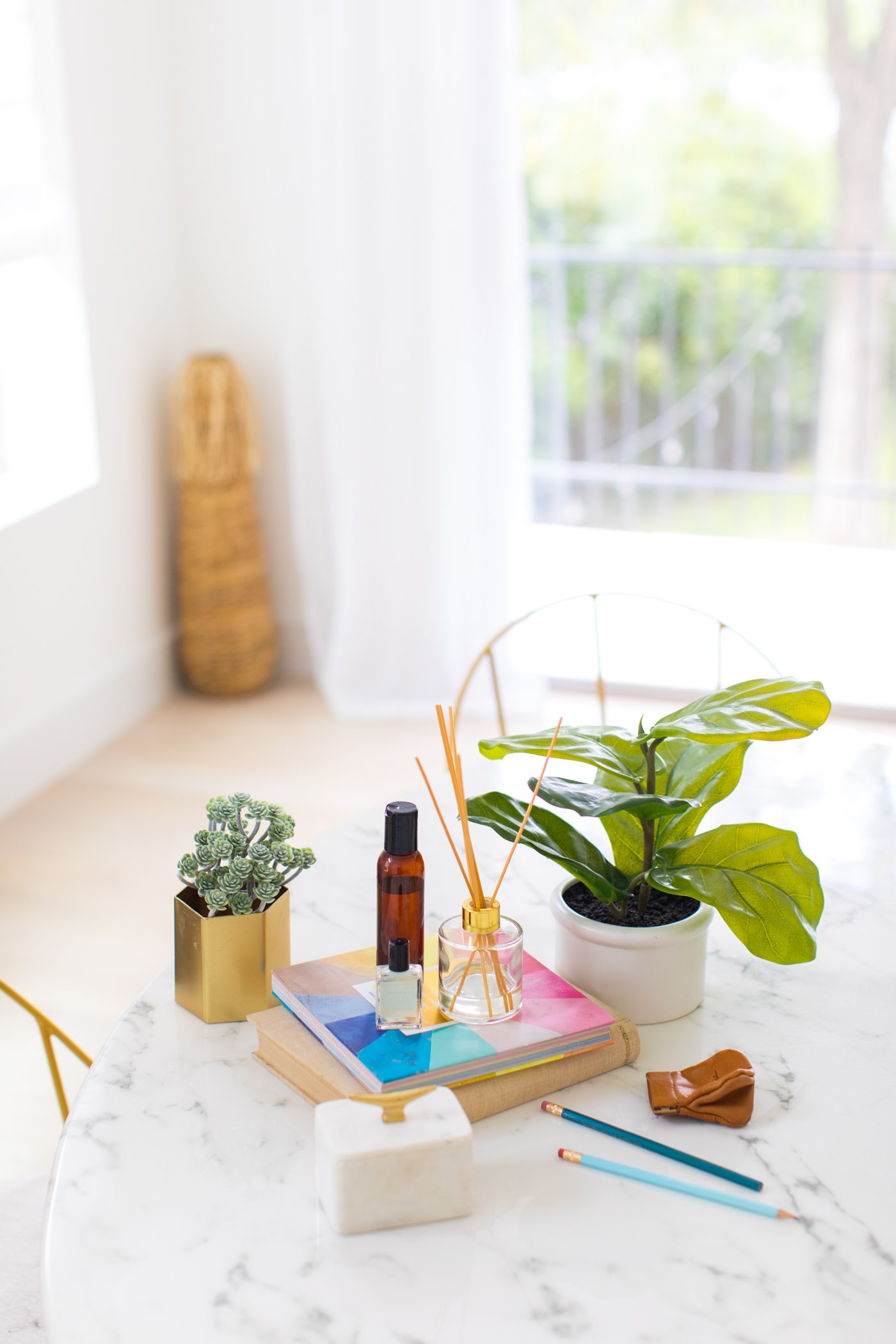 essential oils - photo of a table in sugar and cloth studio by top Houston lifestyle blogger Ashley Rose of Sugar & Cloth