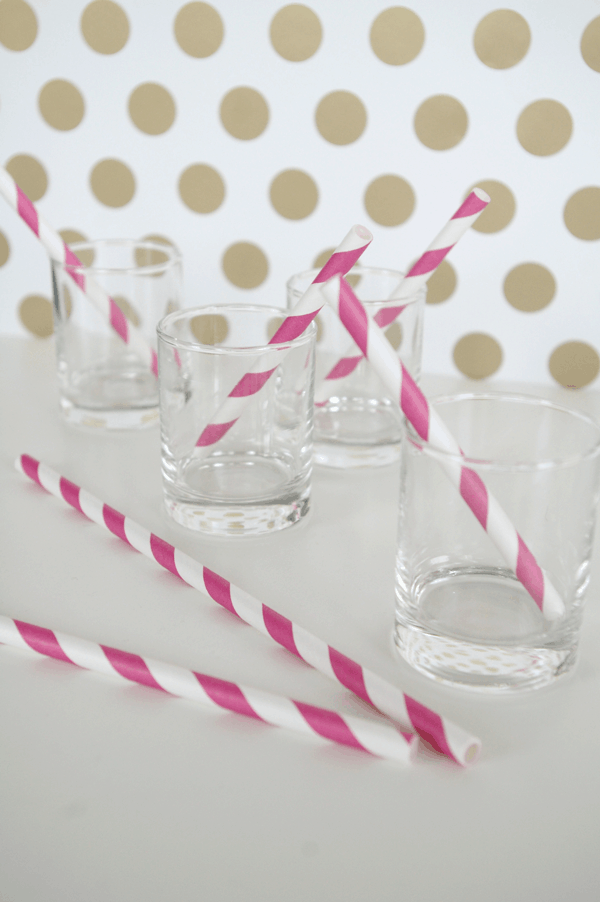 Salted Caramel Ice Cream Cake Shots with pink striped straws