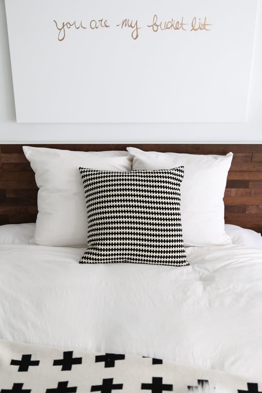 a chic Easy Ikea Hack DIY Wooden Headboard With Stikwood by top houston blogger Ashley Rose of Sugar and cloth