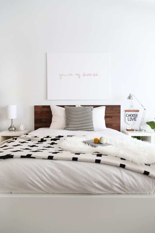 full styled reveal.. Easy Ikea Hack DIY Wood Headboard With Stikwood by top houston blogger Ashley Rose of Sugar and cloth