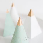 close up photo of wooden cones painted as christmas trees by sugar and cloth