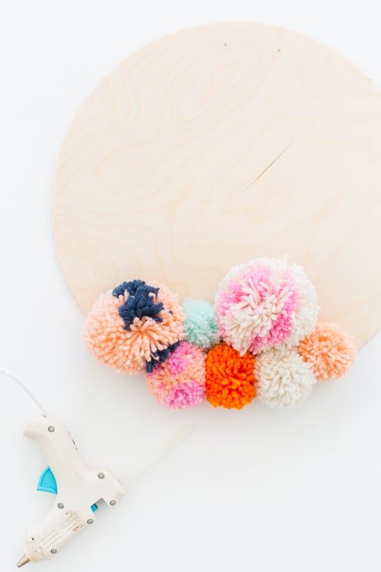 Step 3 -DIY Pom Pom Wall Hanging by Top Lifestyle Blogger Ashley Rose | Sugar & Cloth #DIY #pompom #wallhanging #yarn #yarnpompoms #homedecor #diydecor #colorful #make