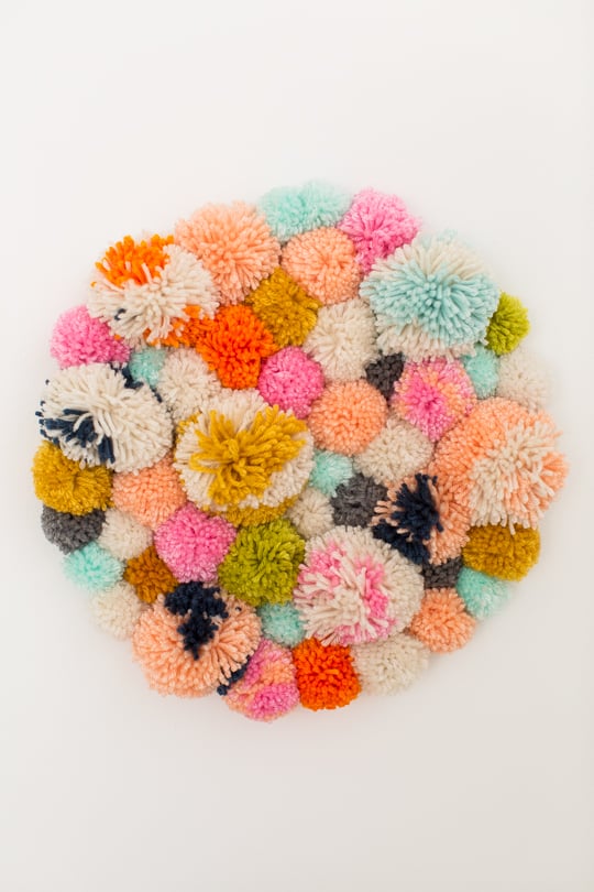 Step 4 - DIY Pom Pom Wall Hanging by Top Lifestyle Blogger Ashley Rose | Sugar & Cloth #DIY #pompom #wallhanging #yarn #yarnpompoms #homedecor #diydecor #colorful #make