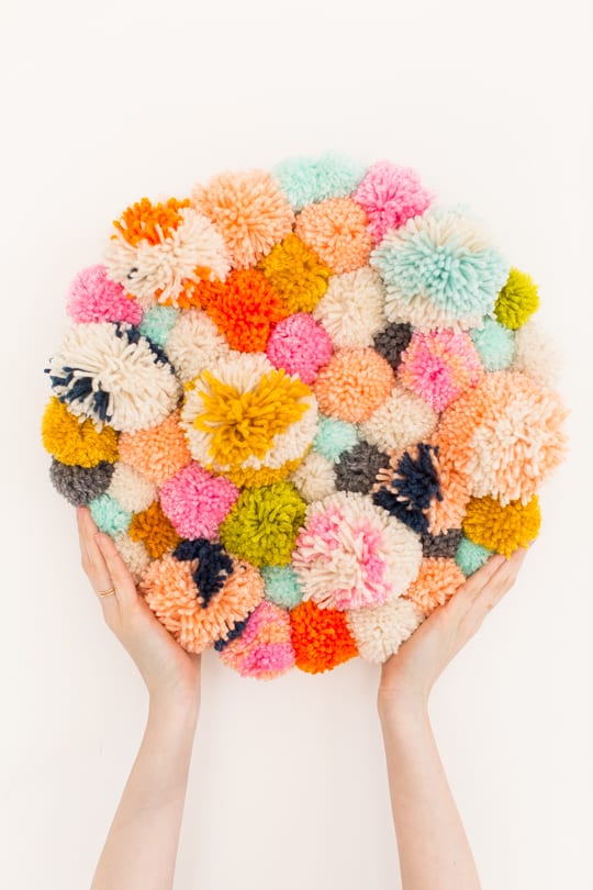 Step 7 -DIY Pom Pom Wall Hanging by Top Lifestyle Blogger Ashley Rose | Sugar & Cloth #DIY #pompom #wallhanging #yarn #yarnpompoms #homedecor #diydecor #colorful #make