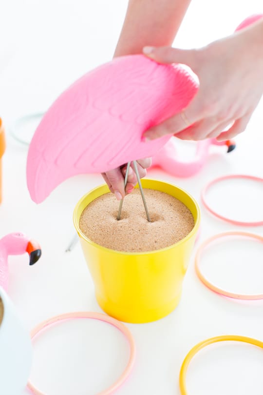 photo of how to make a DIY flamingo ring toss yard game by Ashley Rose of Sugar & Cloth, an award winning DIY and entertaining blog.