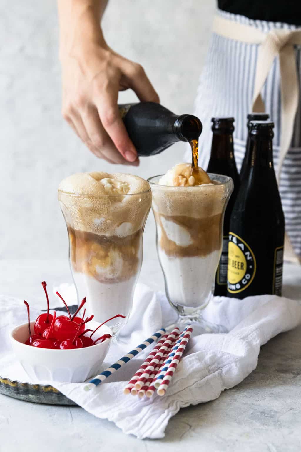 photo of the root beer soda slowly being poured into the ice cream float by top Houston lifestyle blogger Ashley Rose of Sugar & Cloth