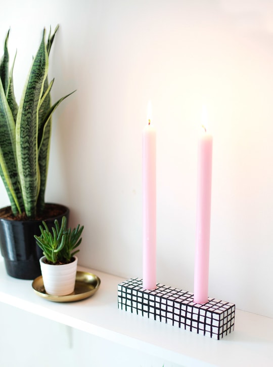 a photo of two candles with plants - diy candle holders