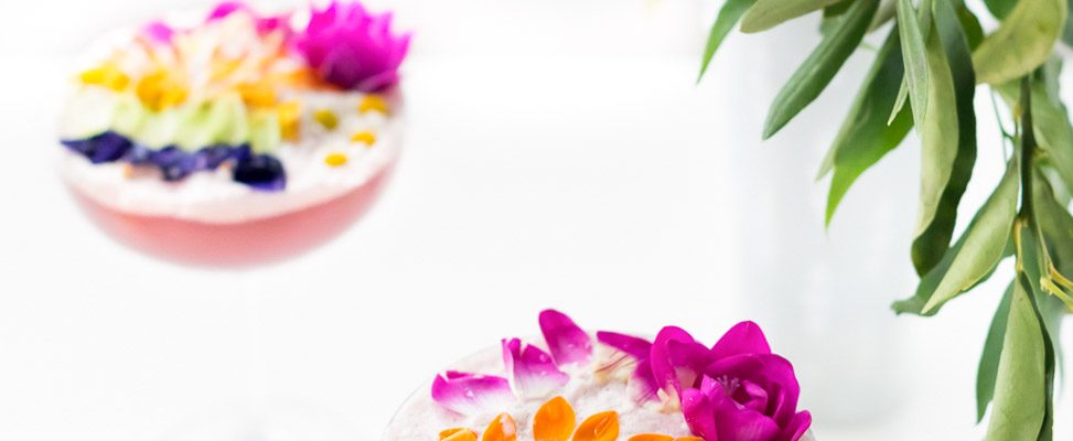 A perfectly Spring edible flower Rainbow Sour cocktail recipe that's almost too pretty to drink! - sugar and cloth