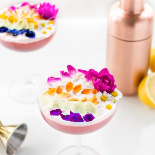 A perfectly Spring edible flower Rainbow Sour cocktail recipe that's almost too pretty to drink! - sugar and cloth