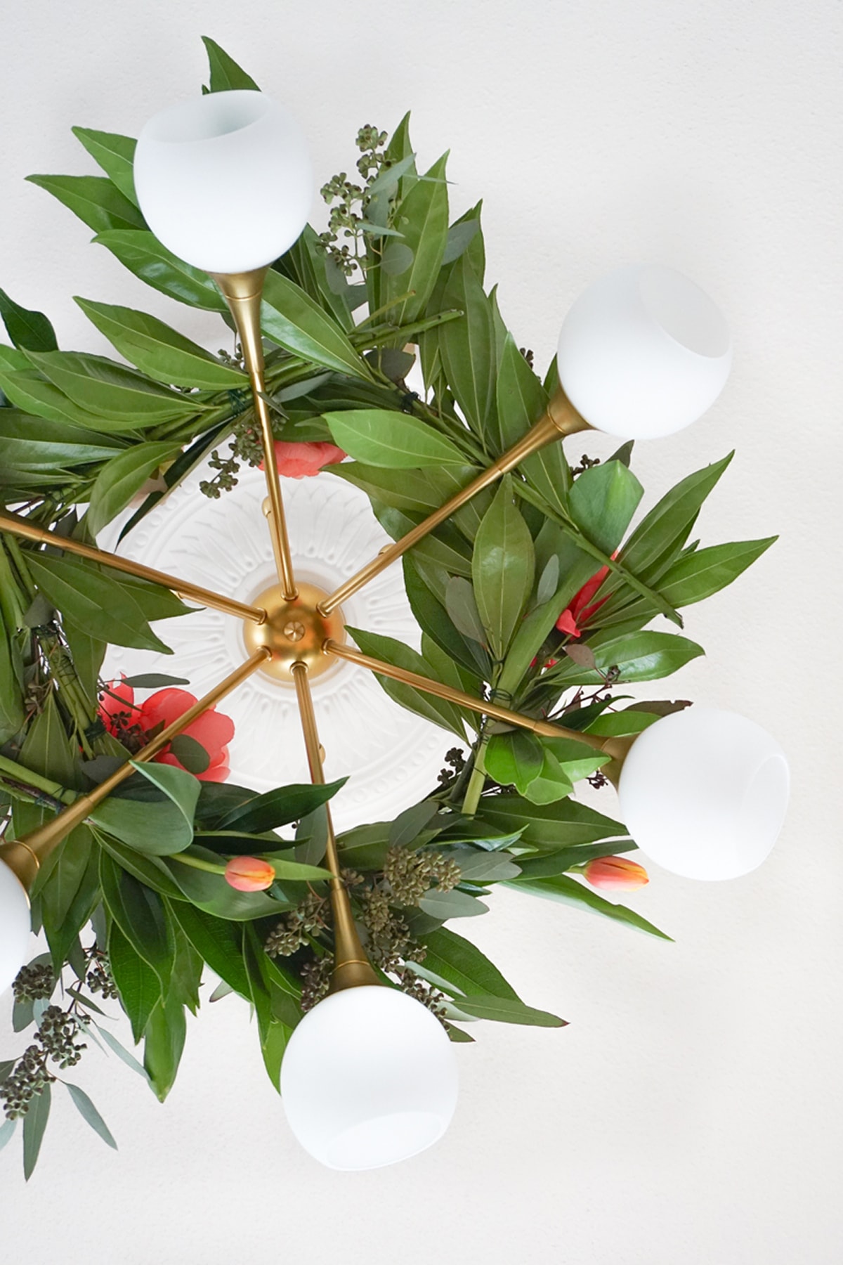 Pretty for Spring! This DIY floral chandelier garland is the perfect touch to your living room decor during your next dinner! - sugar and cloth