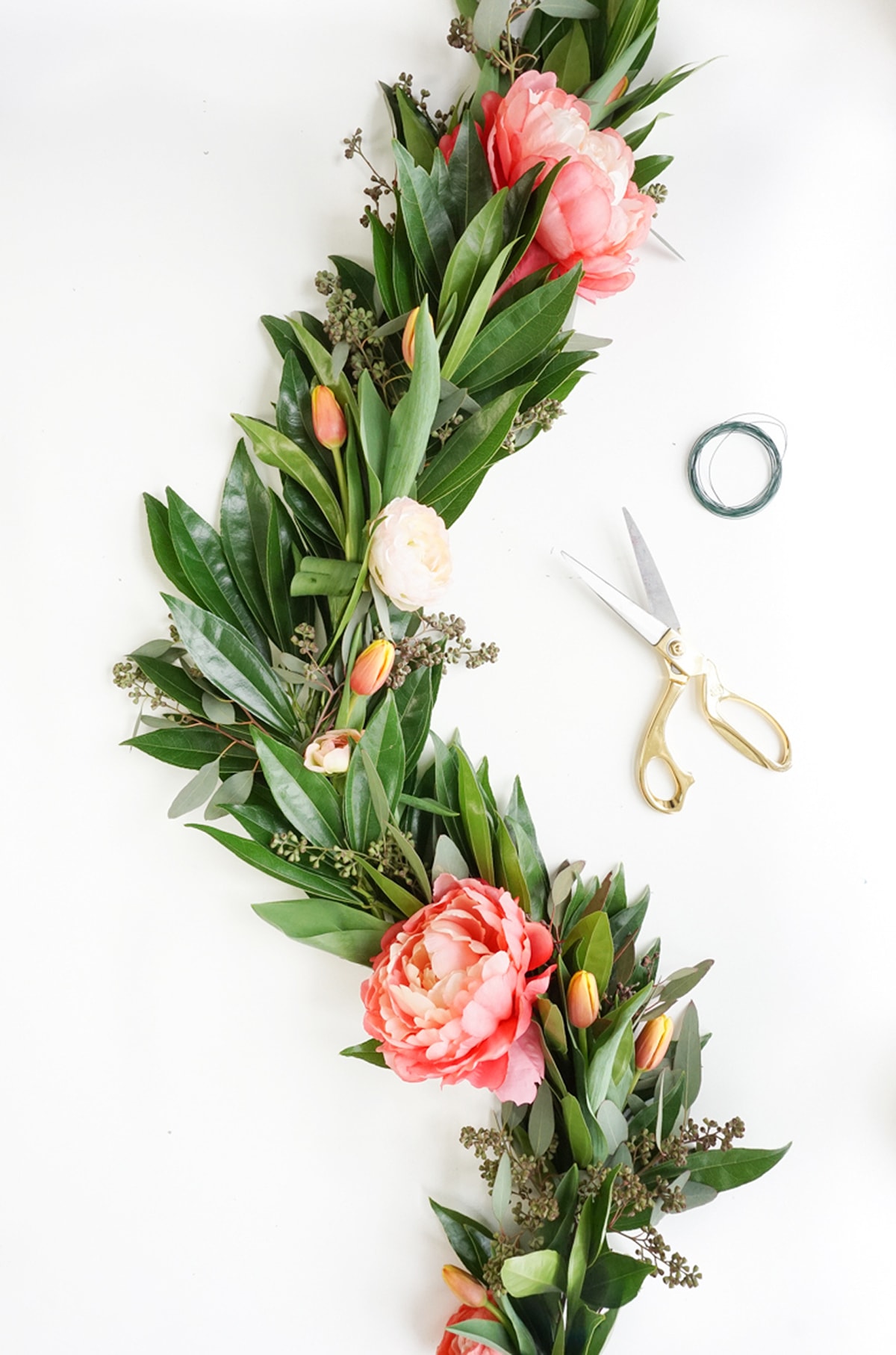 Pretty for Spring! This DIY floral chandelier garland is the perfect touch to your living room decor during your next dinner! - sugar and cloth