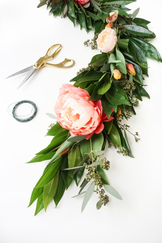 Pretty for Spring! This DIY floral chandelier garland is the perfect touch to your living room decor during your next dinner! - sugar and cloth