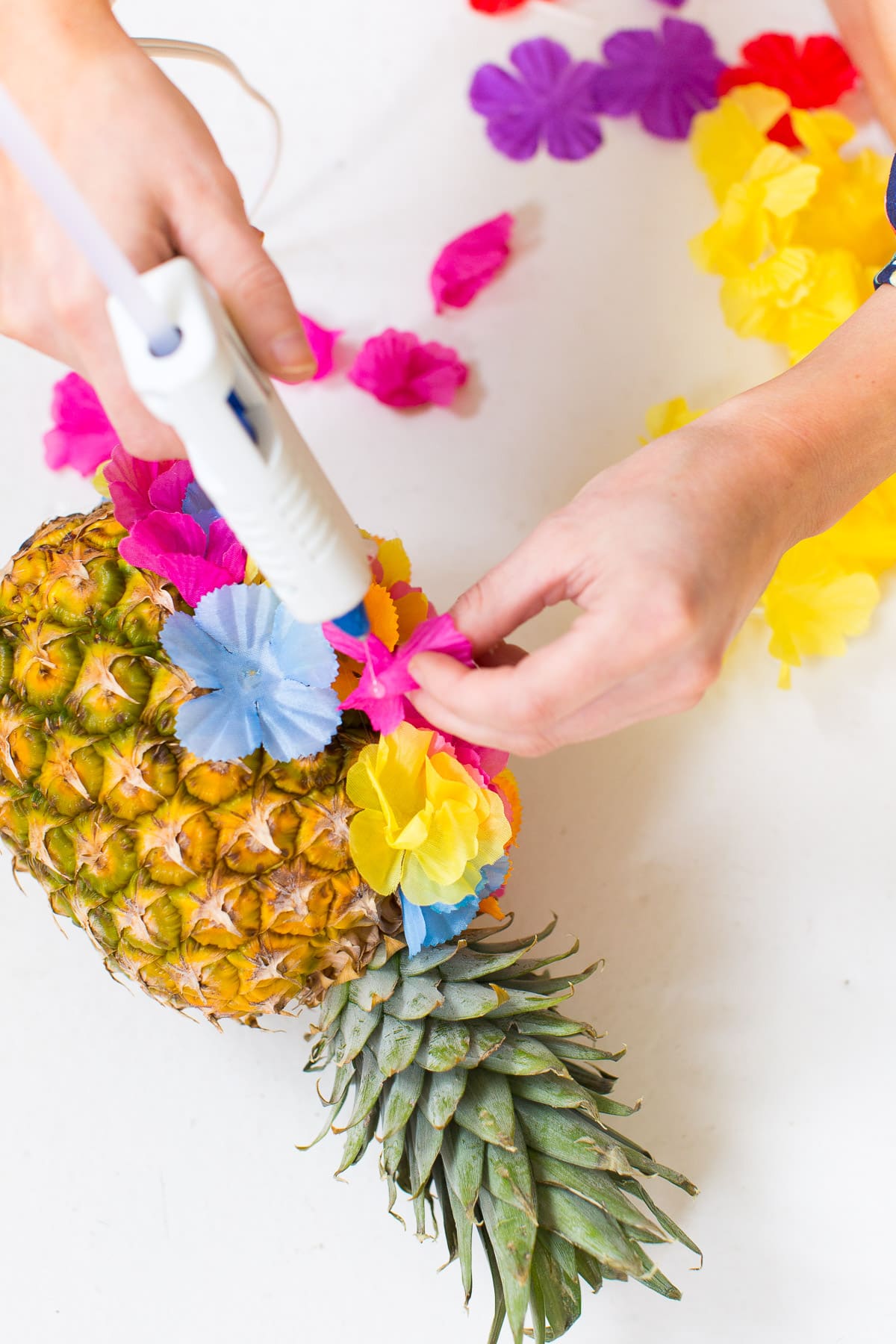 A colorful DIY floral pineapple centerpiece by Sugar & Cloth - houston blogger - summer