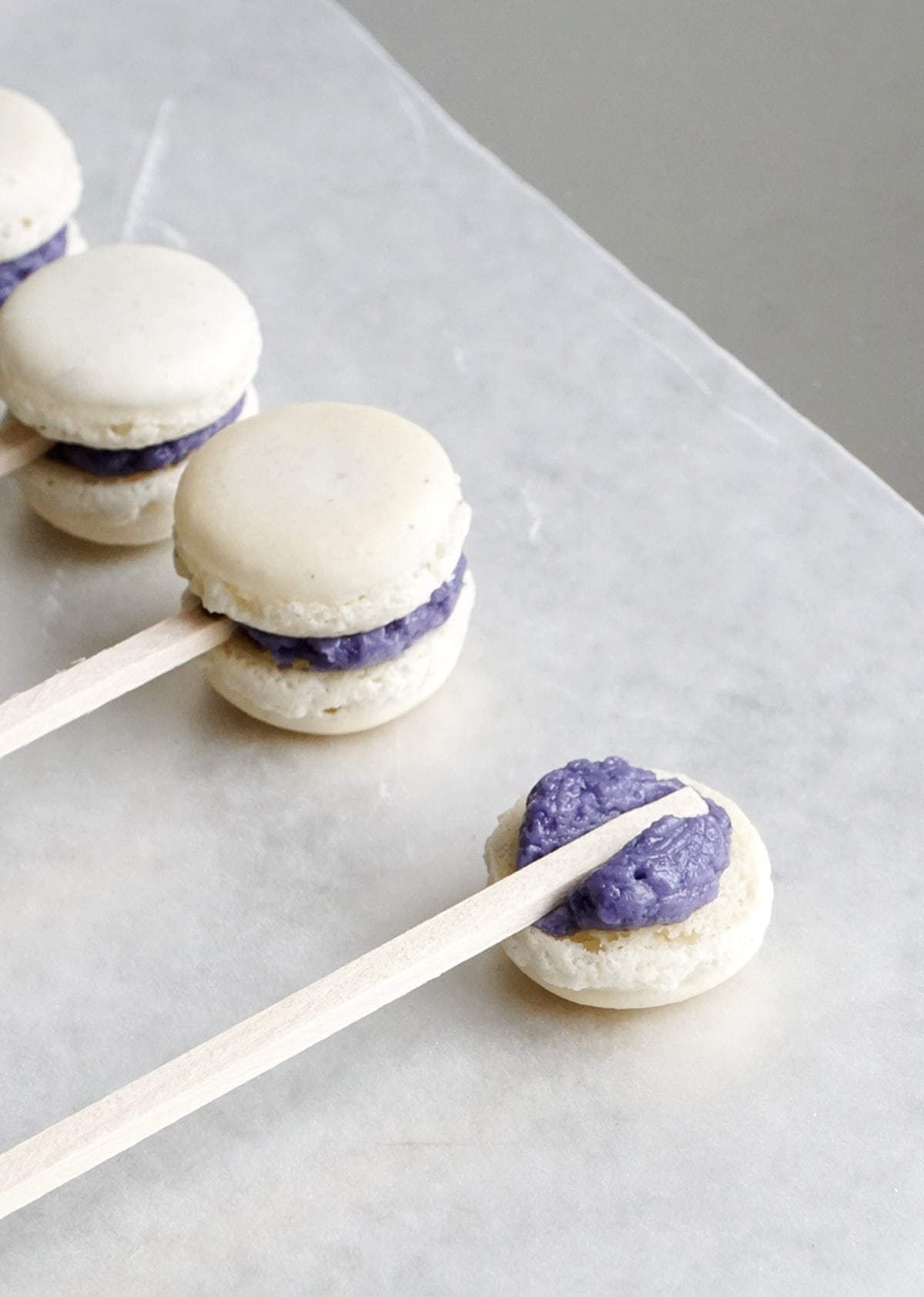 The cutest mini macaron cockail swizzle sticks for garnishing and eating, too! - Sugar and Cloth - houston blogger