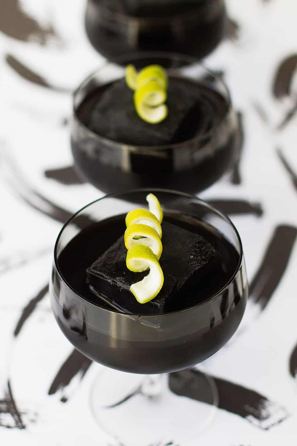 a perfectly halloween cocktail - Detoxing Activated Charcoal Cocktail Recipe by top Houston Lifestyle Blogger Ashley Rose of Sugar and Cloth #recipe #cocktail #halloween #detox #charcoal 