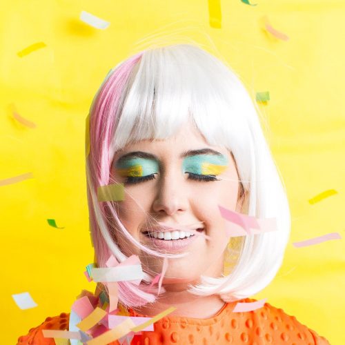 photo of a girl in a striped wig with confetti by sugar and cloth