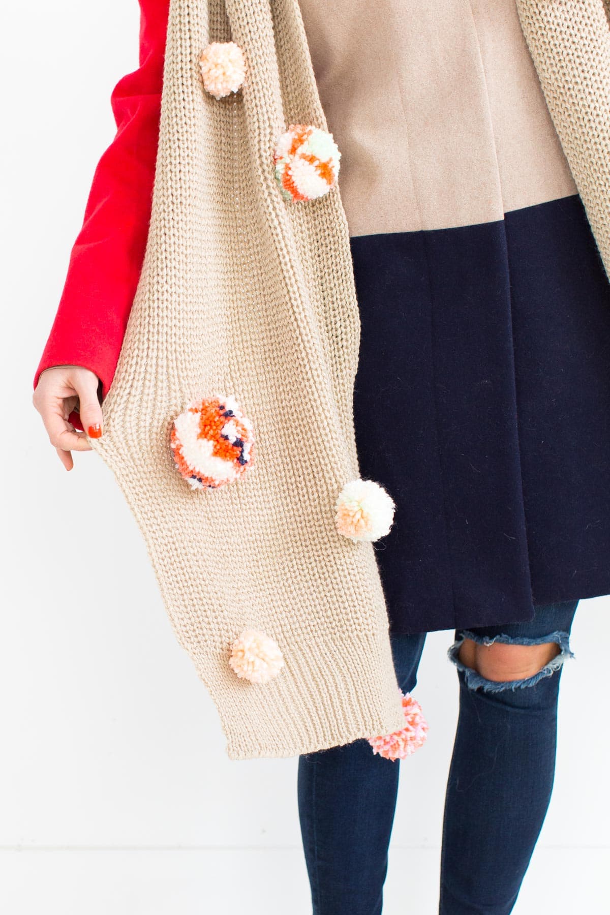 DIY Statement Pom Pom Scarf by Ashley Rose of the award winning DIY and lifestyle blog, Sugar & Cloth.