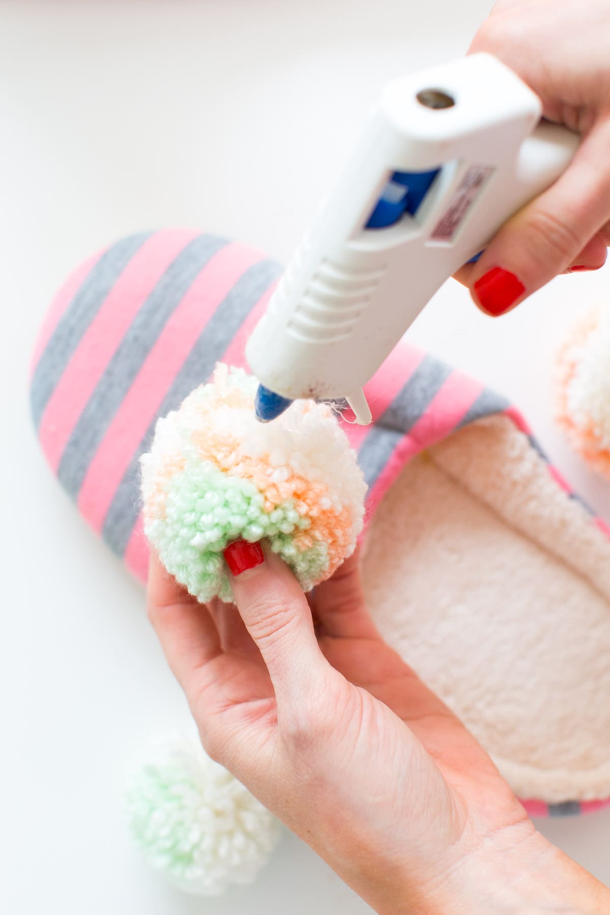 DIY pom pom slippers for Winter by lifestyle blogger and DIY blogger Ashley Rose of Sugar & Cloth