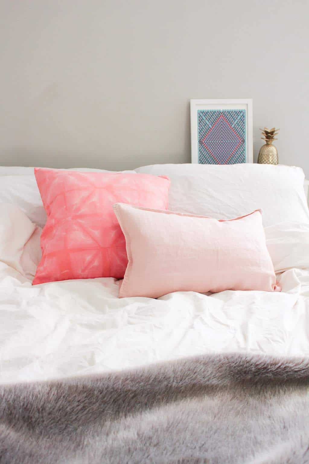 DIY Pink Shibori Throw Pillow by Sugar & Cloth, an award winning DIY and home decor blog.