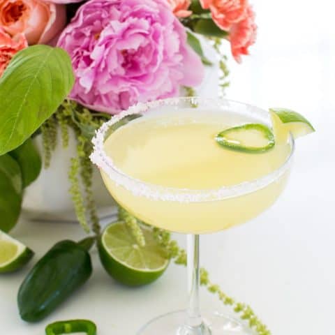 photo of a garnished skinny margarita recipe with salt by sugar and cloth