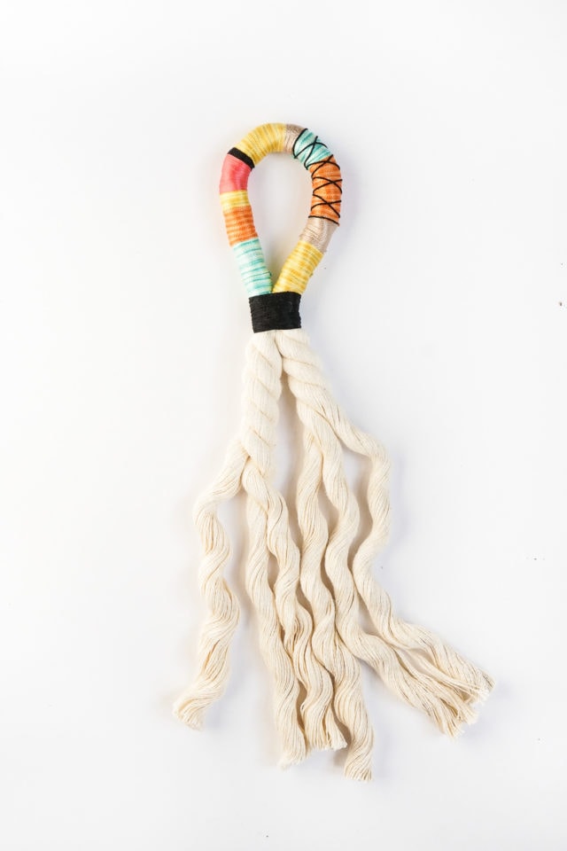 Step 6 - DIY Door Handle Tassels by Ashley Rose of Sugar & Cloth, a top lifestyle blog in Houston, Texas #DIY #door #tassels #fringe #colorful #doorhandle #homedecor #simple #rope #diyhomedecor