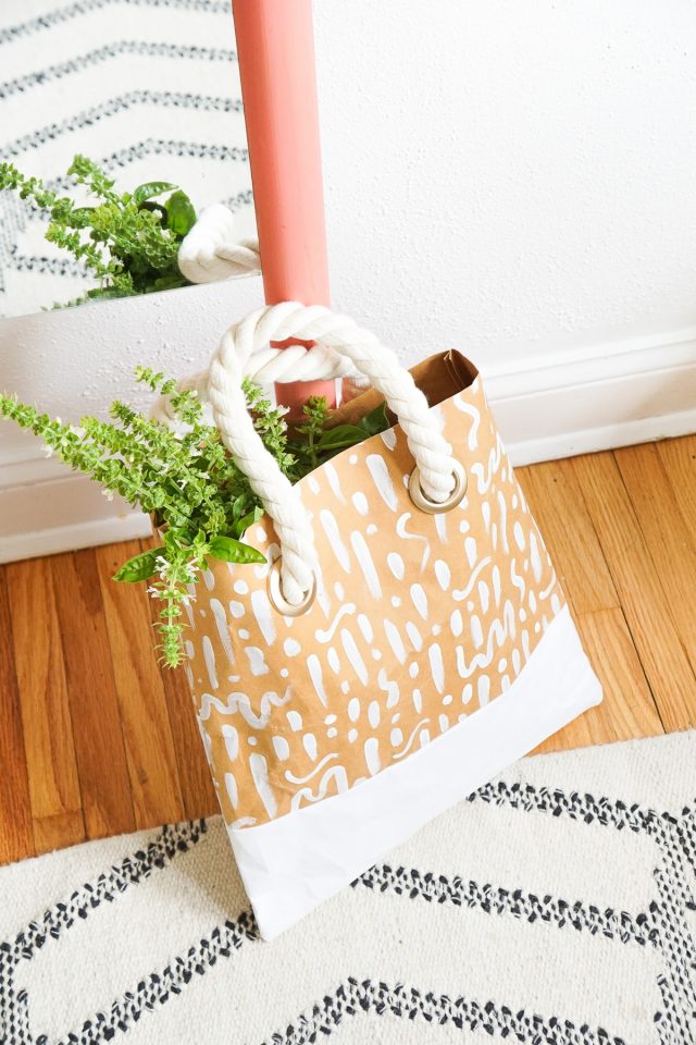 photo of a DIY Patterned Paper Tote made from paper on a rug