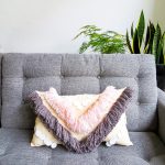 DIY Woven Yarn Fringe Throw Pillow by Ashley Rose of Sugar & Cloth, a top lifestyle blog in Houston, Texas