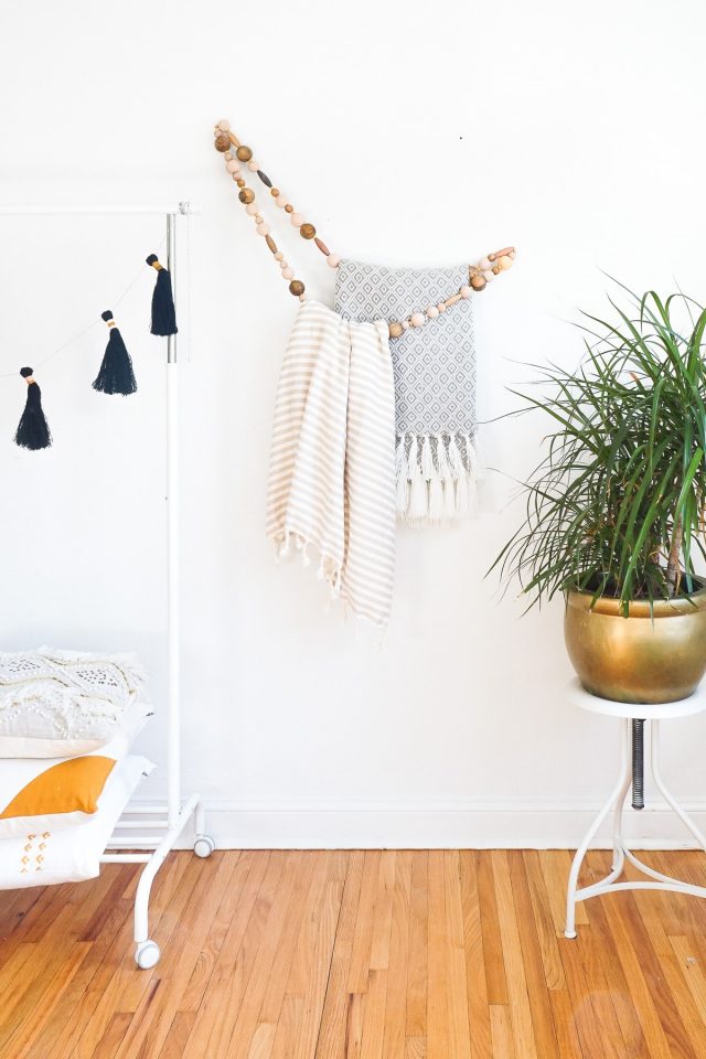 DIY gifts  - DIY Minimal Beaded Blanket Holder in a living room