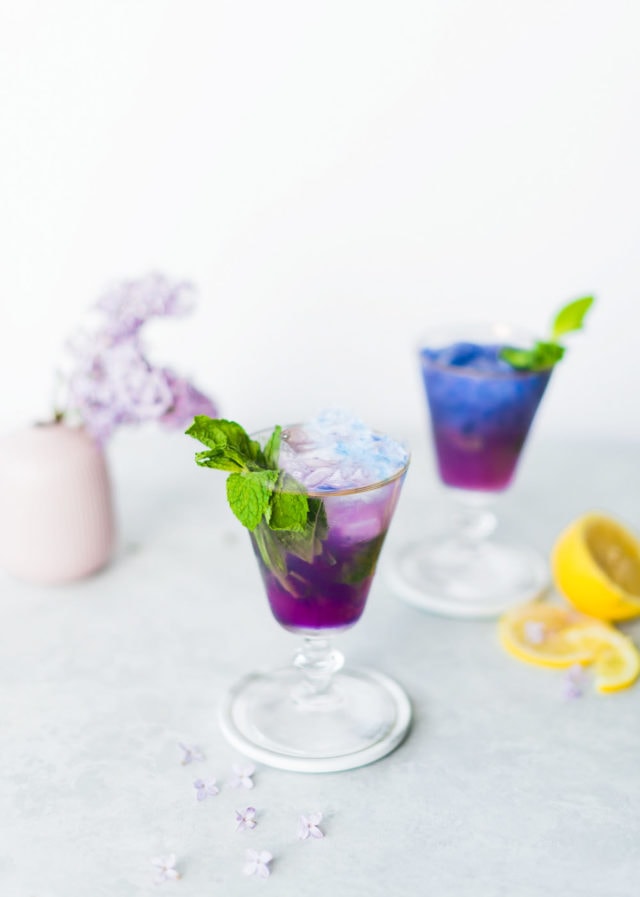 photo of the Butterfly Pea Flower Tea Cocktail changing from blue tea to purple by top Houston lifestyle blogger Ashley Rose of Sugar & Cloth