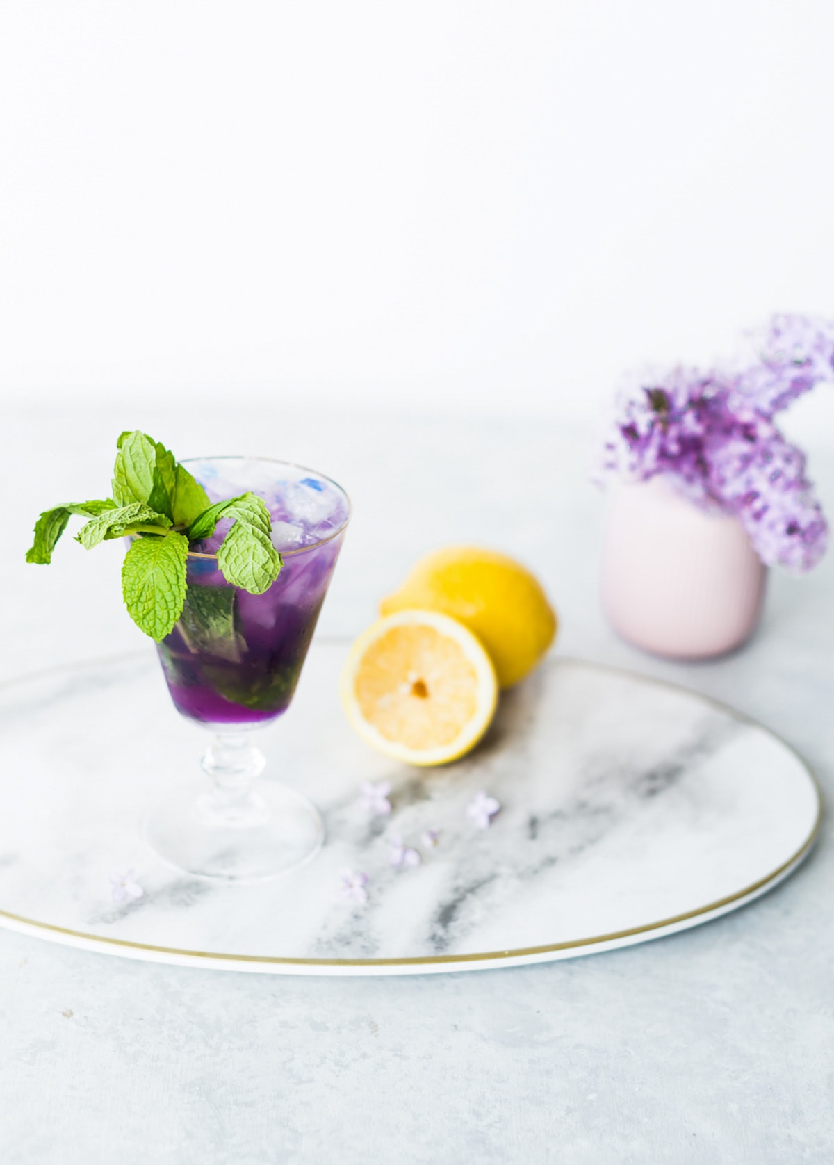 photo of a mint julep inspired cocktail, the Butterfly Pea Flower Tea Cocktail recipe by top Houston lifestyle blogger Ashley Rose of Sugar & Cloth