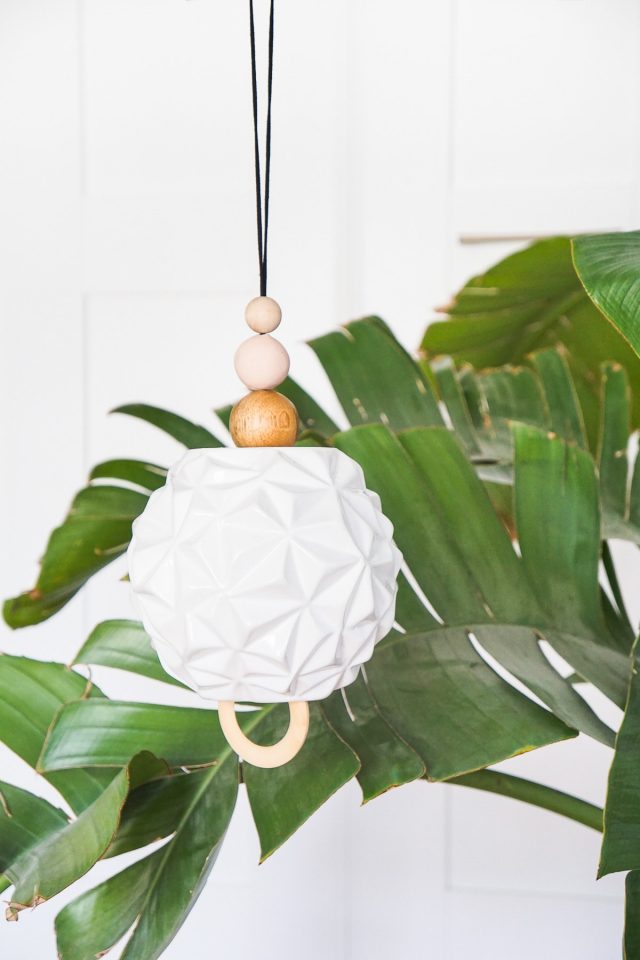 DIY sculptural wind chime by a plant