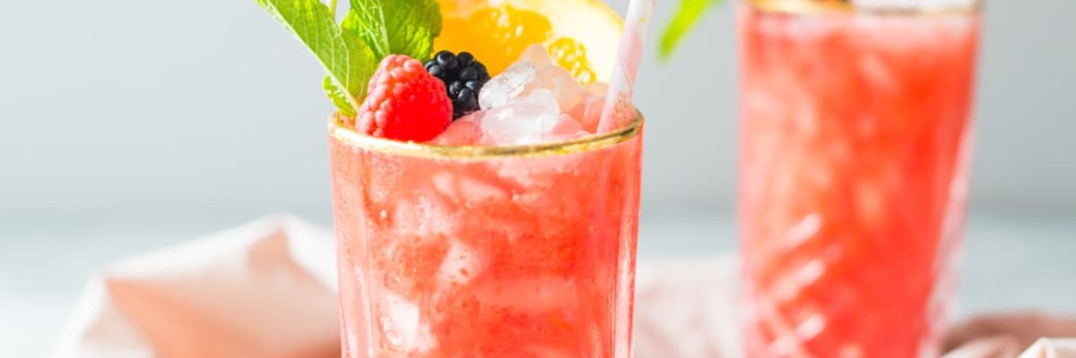 picture of two styled sherry berry cocktails by sugar and cloth