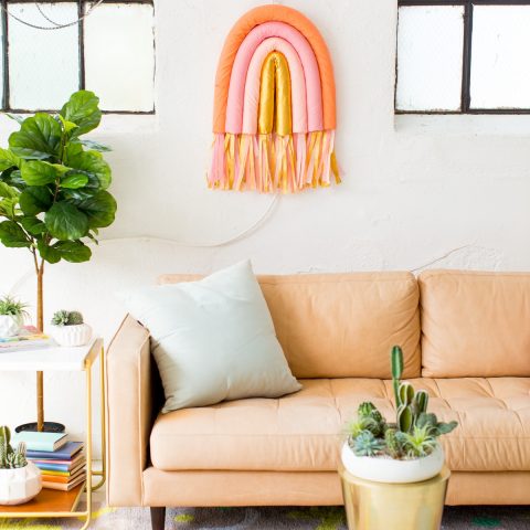 DIY Rainbow Art Wall Hanging by top Houston lifestyle blogger Ashley Rose of Sugar and Cloth #wallart #homedecor #diy #rainbow #decor #parties #partydecor