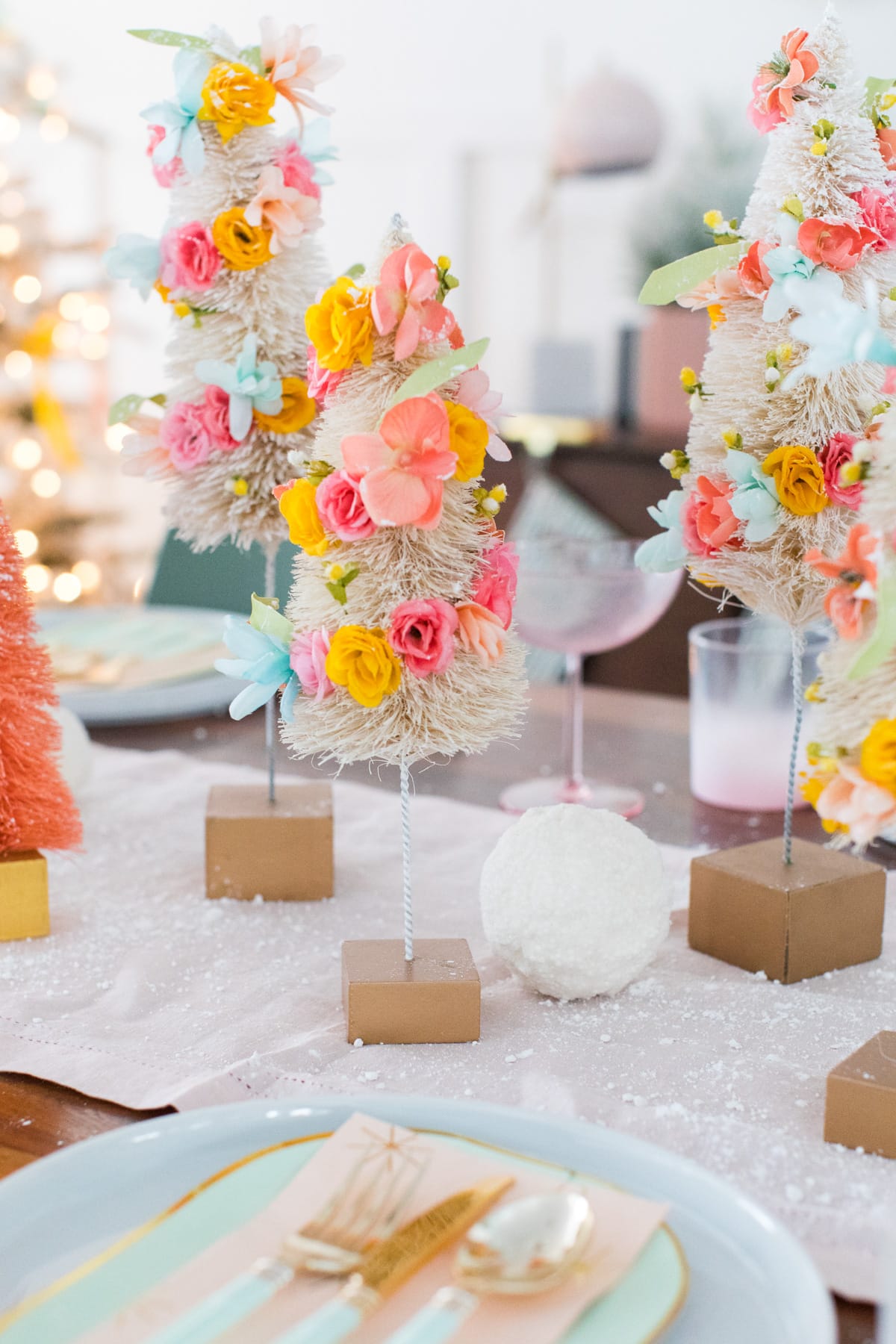 or mix them with faux snowballs - Faux Flower Bottle Brush Tree DIY Christmas Centerpiece Idea by top Houston lifestyle blogger Ashley Rose of Sugar and Cloth #diy #christmas #decor #howto #craft #entertaining #centerpiece #ideas