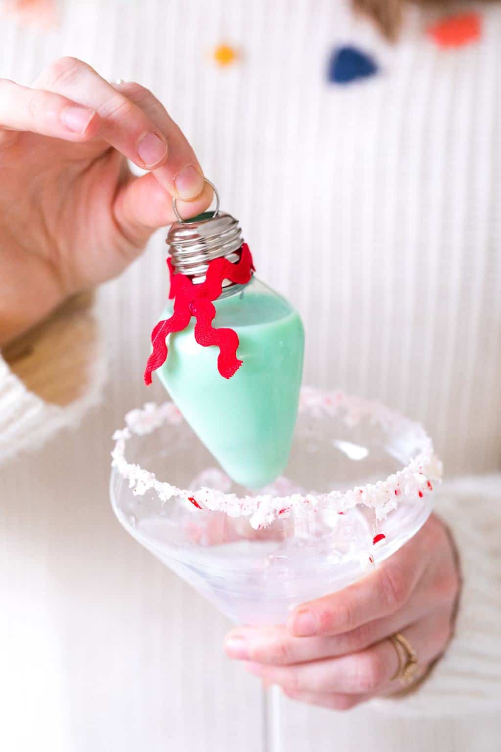 serving up rumchata holiday ornaments! Pour your own ornament holiday cocktail! How to Make an Easy Christmas Cocktail Ornament by top Houston lifestyle blogger Ashley Rose of Sugar & Cloth #christmas #cocktail #easy #ideas #holidays #winter #ornament #decor #recipe
