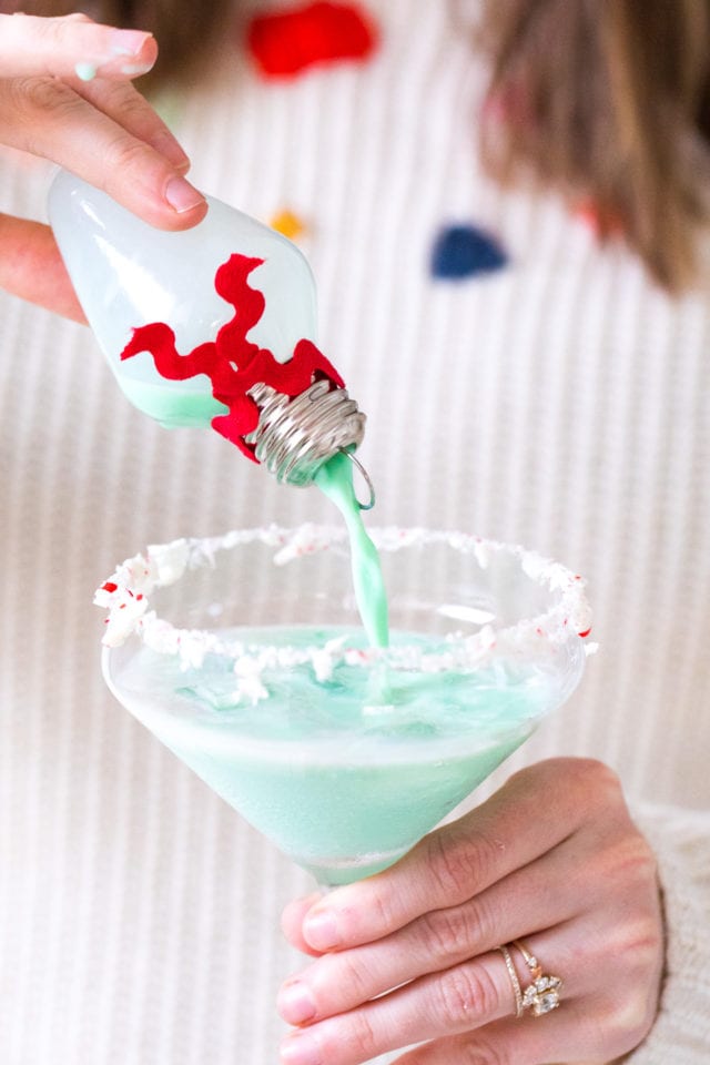 Pour your own ornament holiday cocktail! How to Make an Easy Christmas Cocktails in Ornaments by top Houston lifestyle blogger Ashley Rose of Sugar & Cloth #christmas #cocktail #easy #ideas #holidays #winter #ornament #decor #recipe