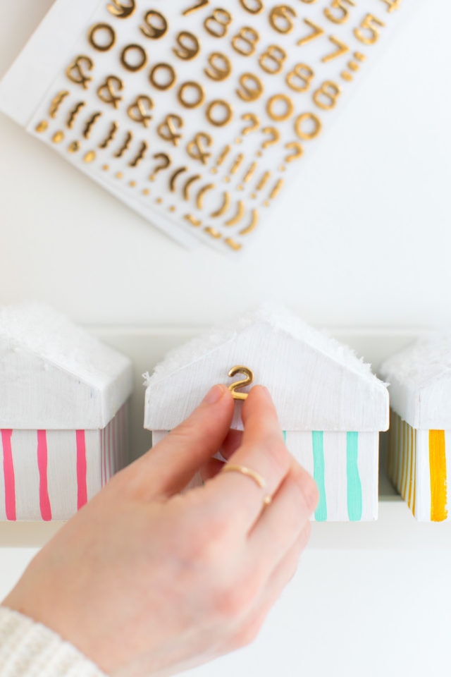 putting the numbers on - Colorful Houses DIY Advent Calendar by top Houston lifesyle blogger Ashley Rose of Sugar and Cloth #diy #christmas #advent #holiday #decor #idea #howto #kids #crafts