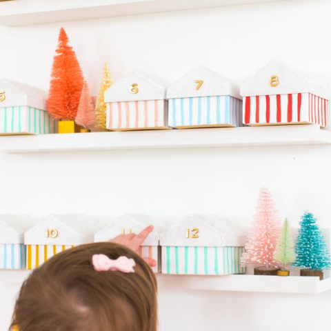 Gwen loves the colorful boxes advent calendar - Colorful Houses DIY Advent Calendar by top Houston lifesyle blogger Ashley Rose of Sugar and Cloth #diy #christmas #advent #holiday #decor #idea #howto #kids #crafts