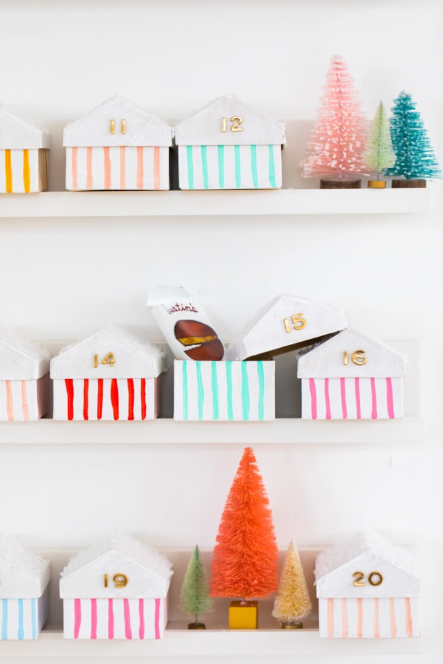 cute idea of what to put in an advent calendar! Colorful Houses DIY Advent Calendar by top Houston lifesyle blogger Ashley Rose of Sugar and Cloth #diy #christmas #advent #holiday #decor #idea #howto #kids #crafts