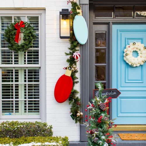 photo of a house with christmas wreaths and garland for front door decorations