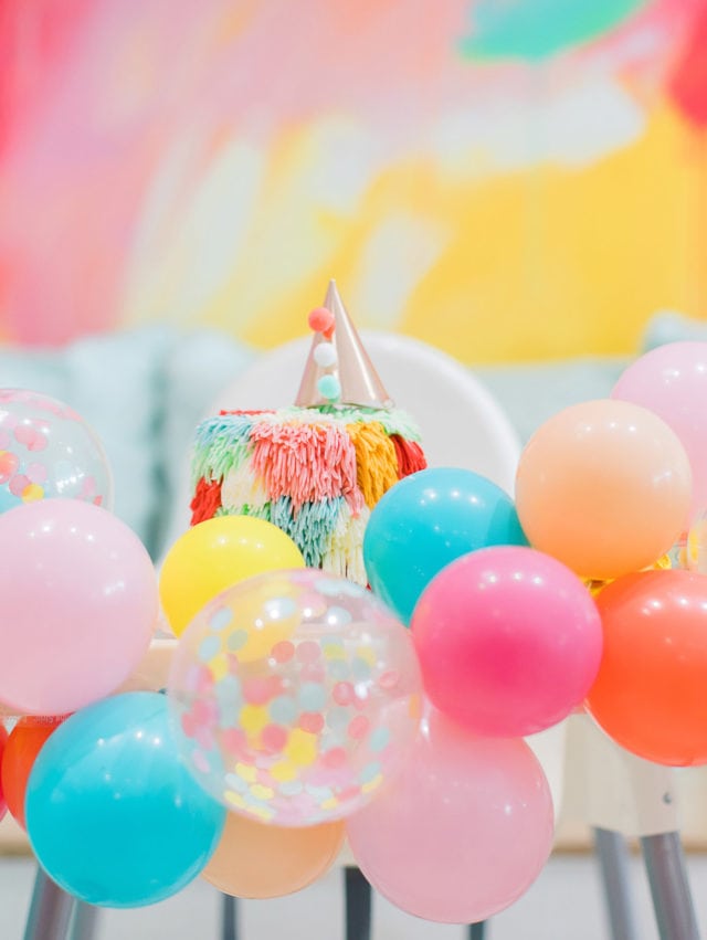 rainbow smash cake and balloon garland from Glamfetti Co