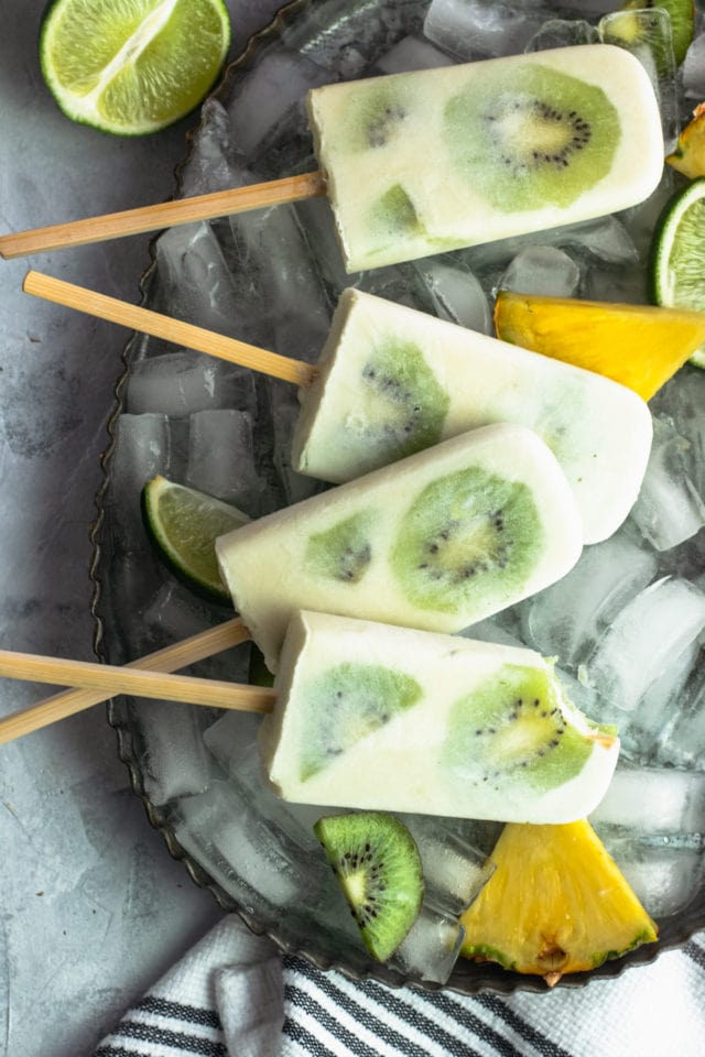 Whole 30 Tropical Popsicles Recipe Bite by top Houston lifestyle blogger Ashley Rose of Sugar & Cloth