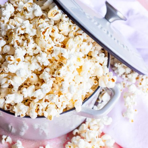 overhead photo of flavored popcorn by sugar and cloth