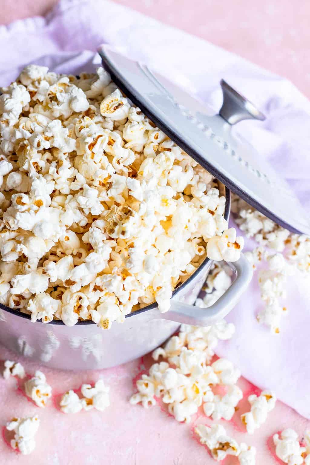 overhead photo of flavored popcorn by sugar and cloth