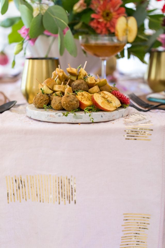 photo of the edge of a table showing the DIY table runner gold details