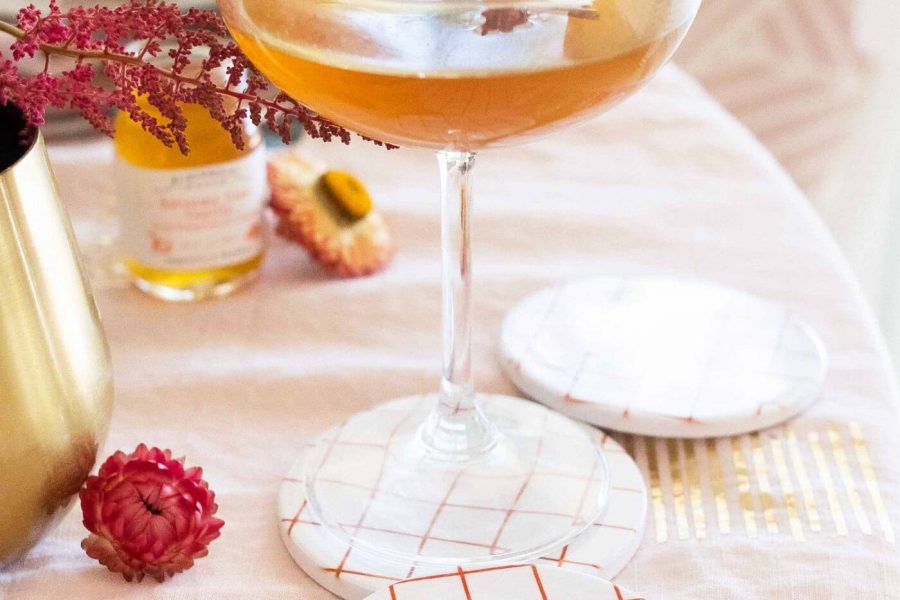 close up photo of a cocktail and DIY coasters made with cricut infusible ink by sugar and cloth
