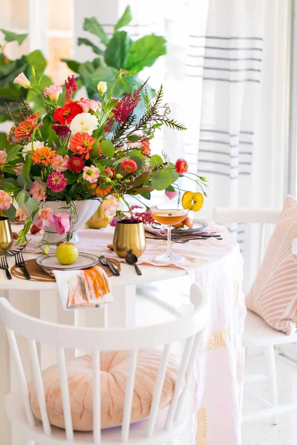 photo of the corner of a decorated fall dining table by sugar and cloth in houston
