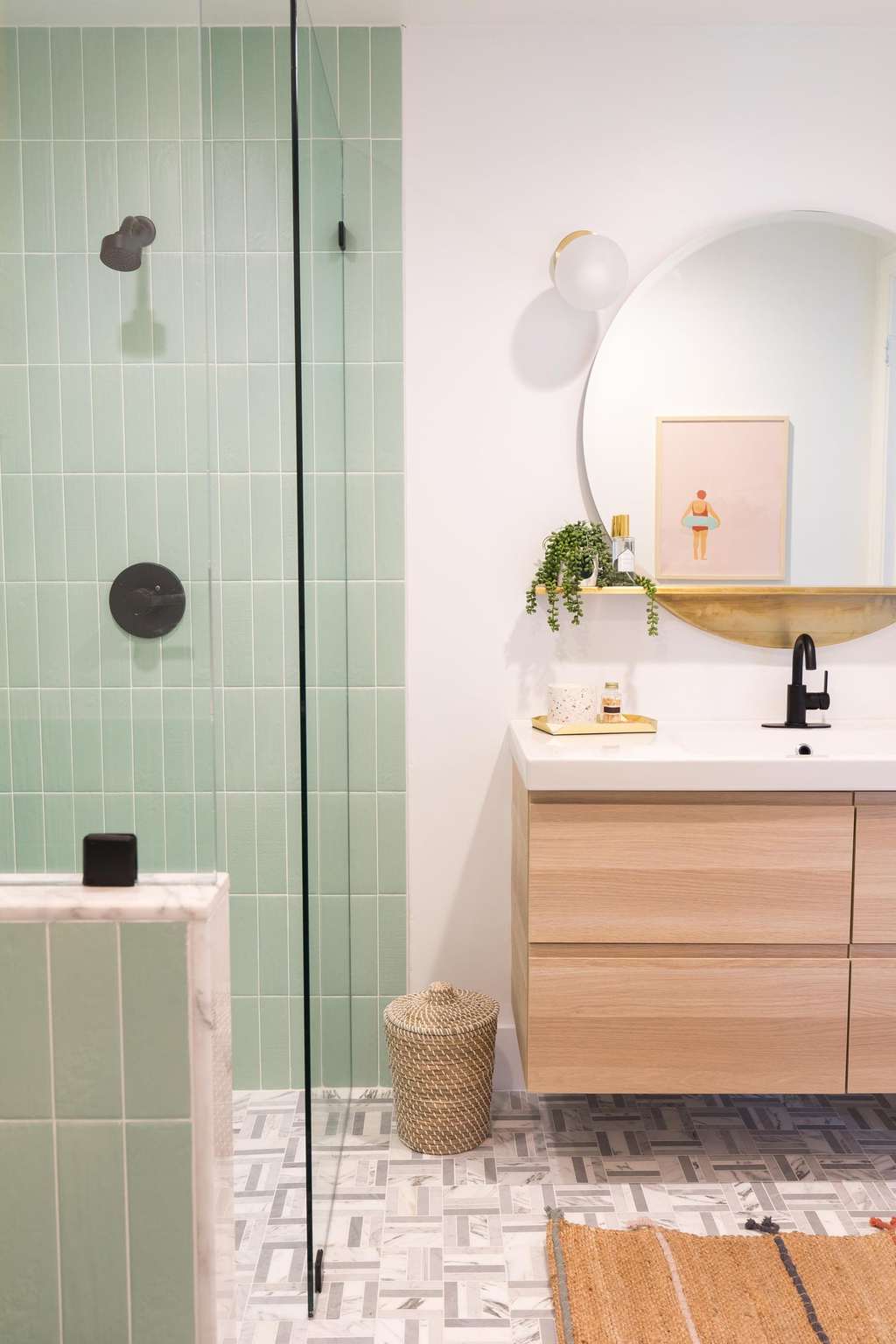 vertical photo of our walk in shower and new vanity from our guest bathroom remodel