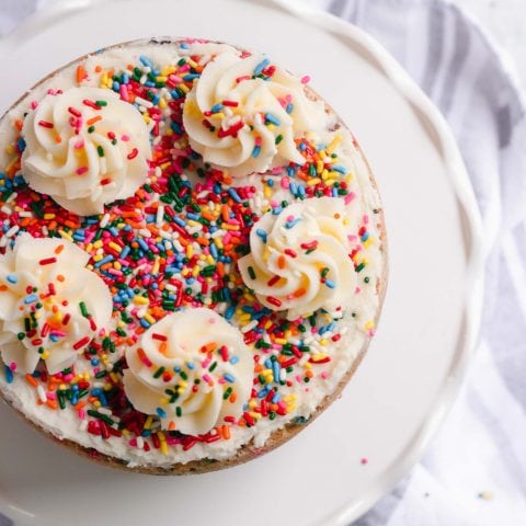 overhead photo of a cake with sprinkles on it