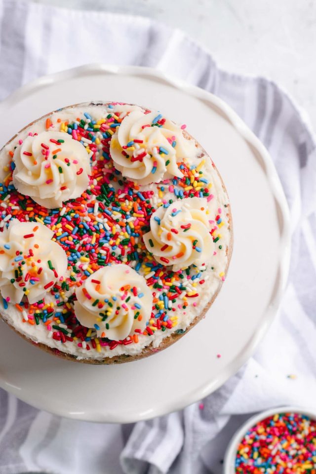 photo of the top of the Funfetti Cake recipe with rose and sprinkle toppings by top Houston lifestyle blogger Ashley Rose of Sugar & Cloth